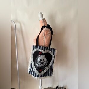 Dolls Kill catty clown cat tote bag